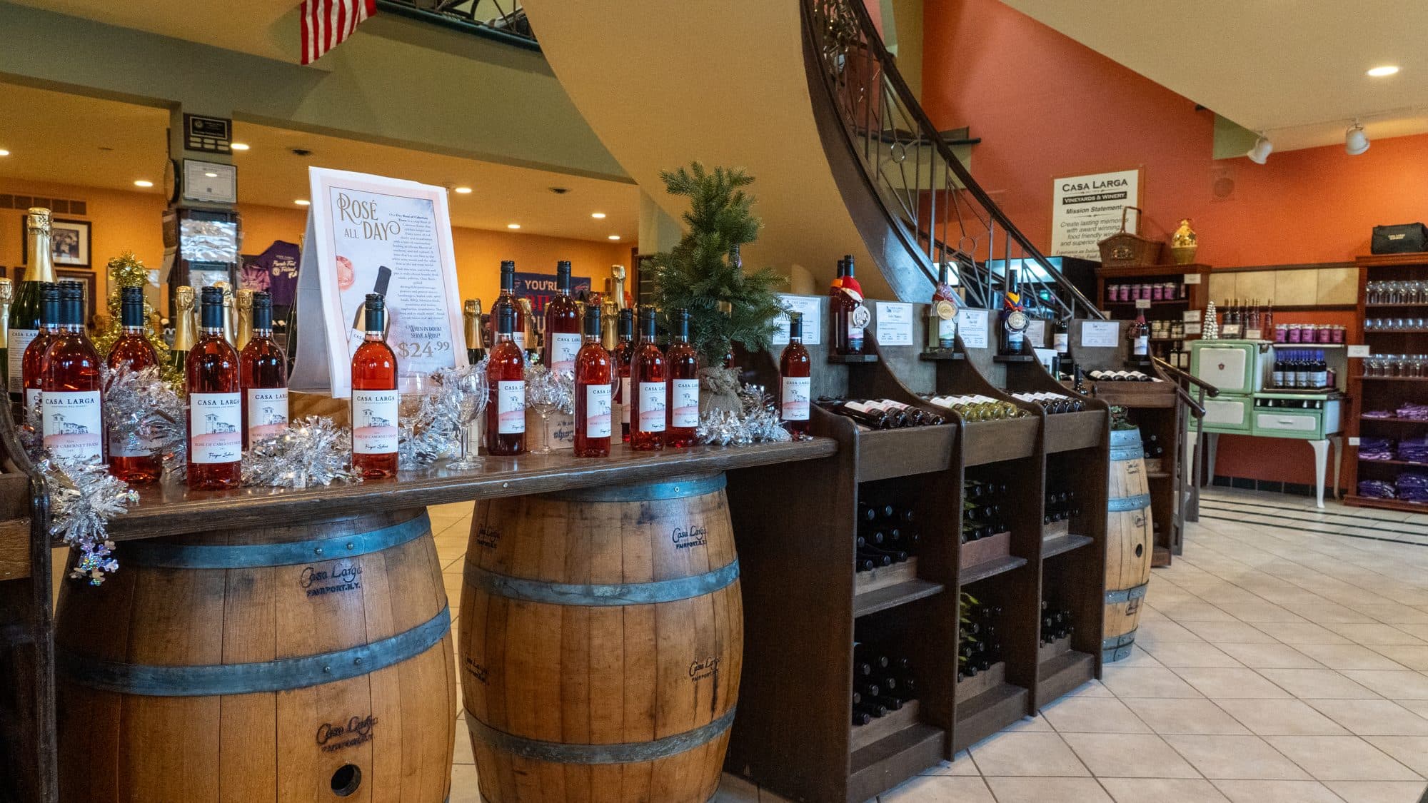 The Casa Larga wine shop, with bottles of Dry Rosé on wine barrels