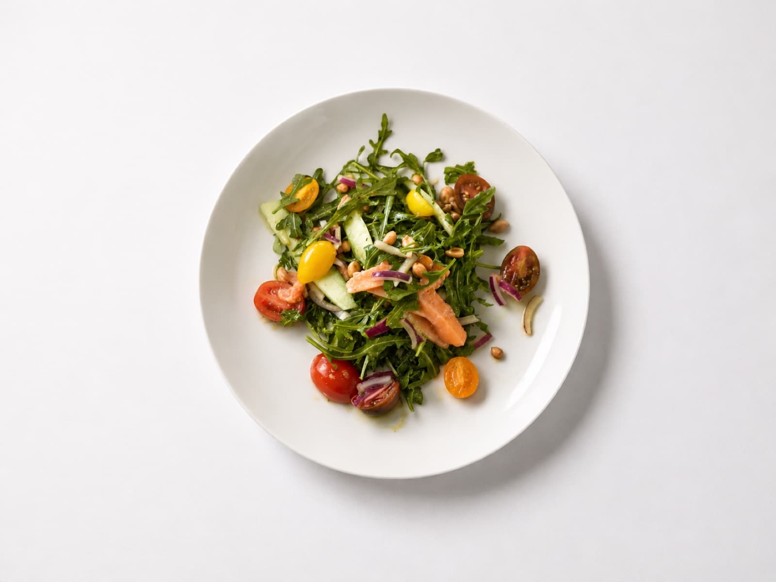 Composed arugula salad with heirloom tomatoes