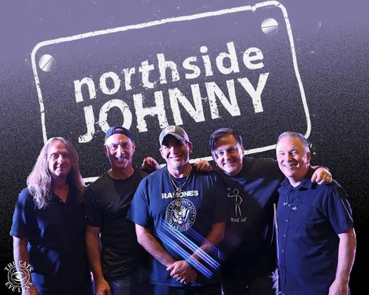 Northside Johnny in front of the band logo